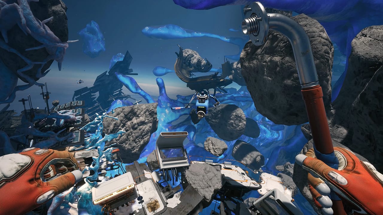 First-person Breathedge 2 view with orange gloves, a pipe tool, and a Cosmostation terminal among glowing debris.